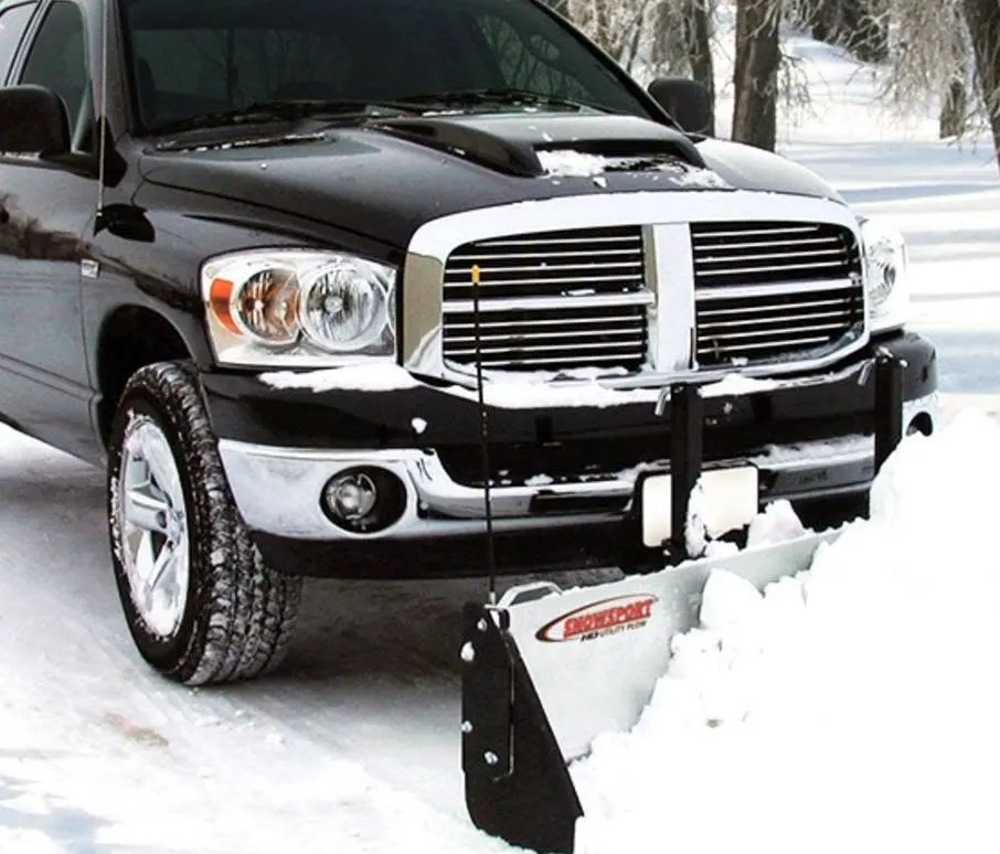 Front of a black Dodge pickup with a plow mount in the snow, Webster, NY